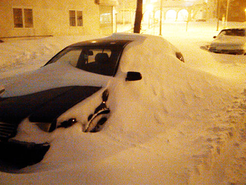 Car buried in Minneapolis blizzard.