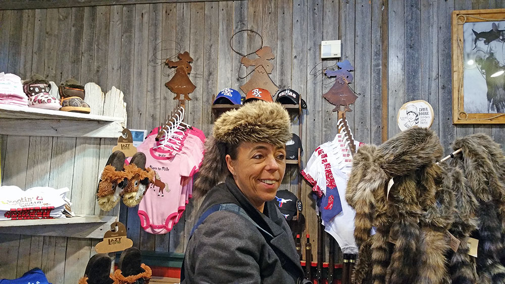My mother modeling a coon cap at the Fort Worth stockyards.
