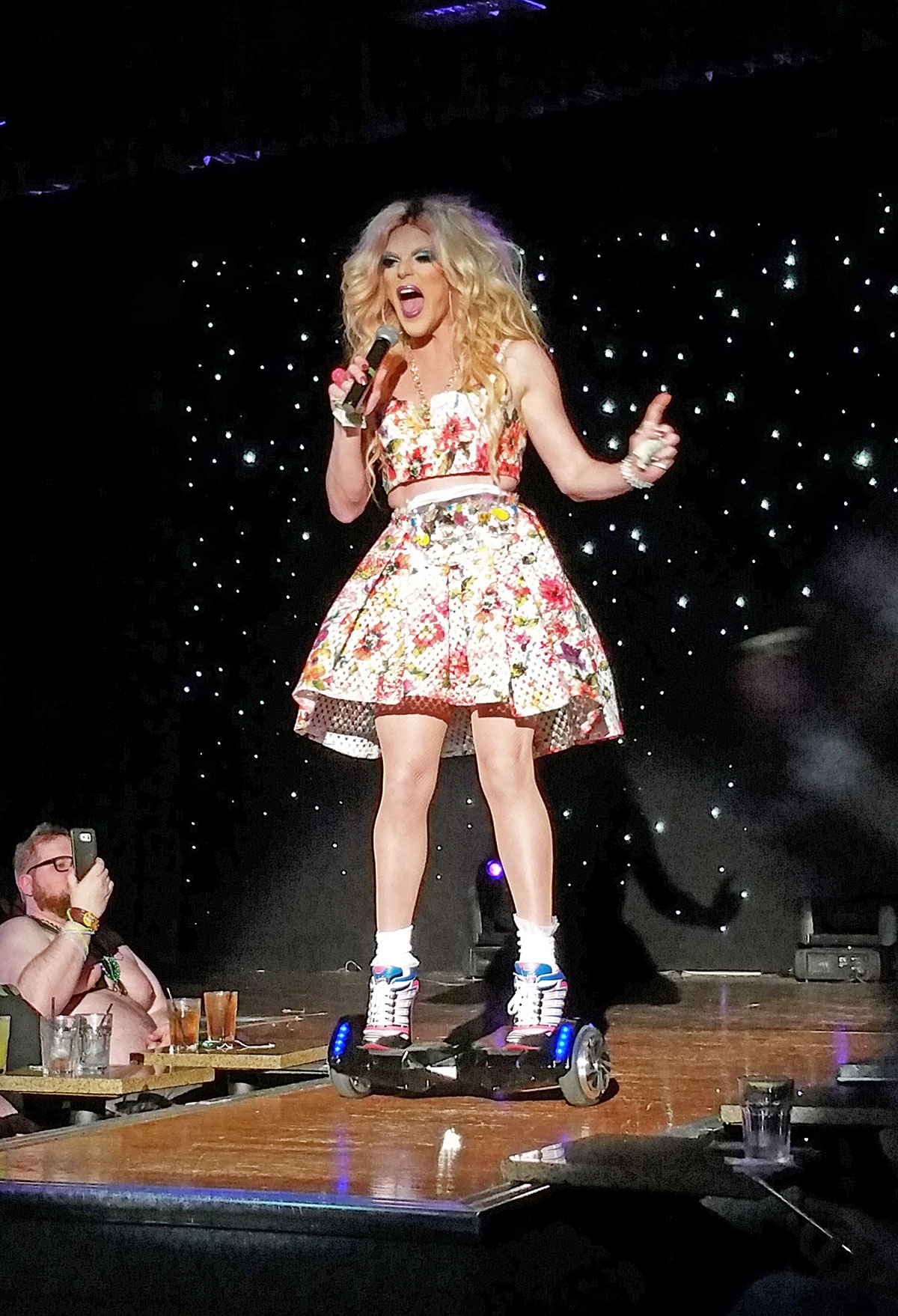 Willam performing on a hover board.