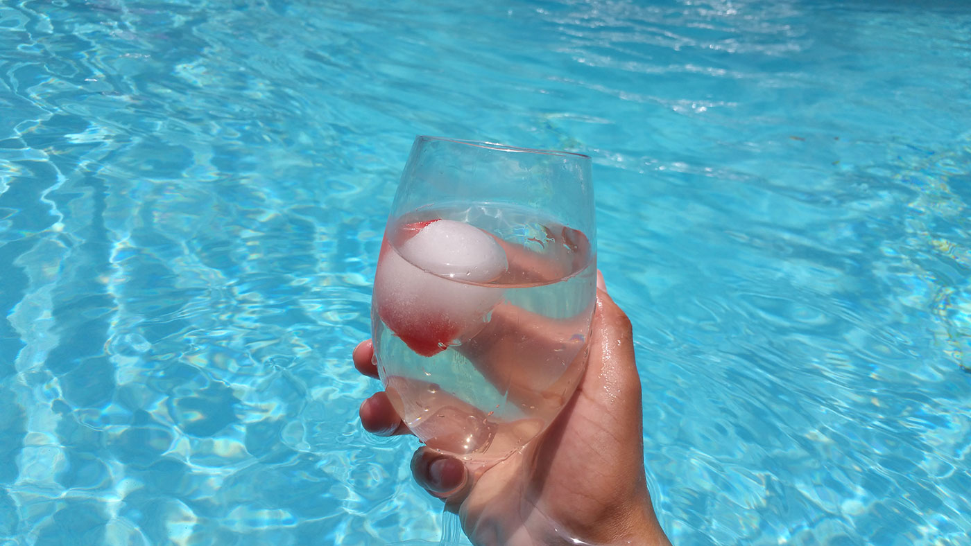Watermelon sphere ice cubes at the pool.