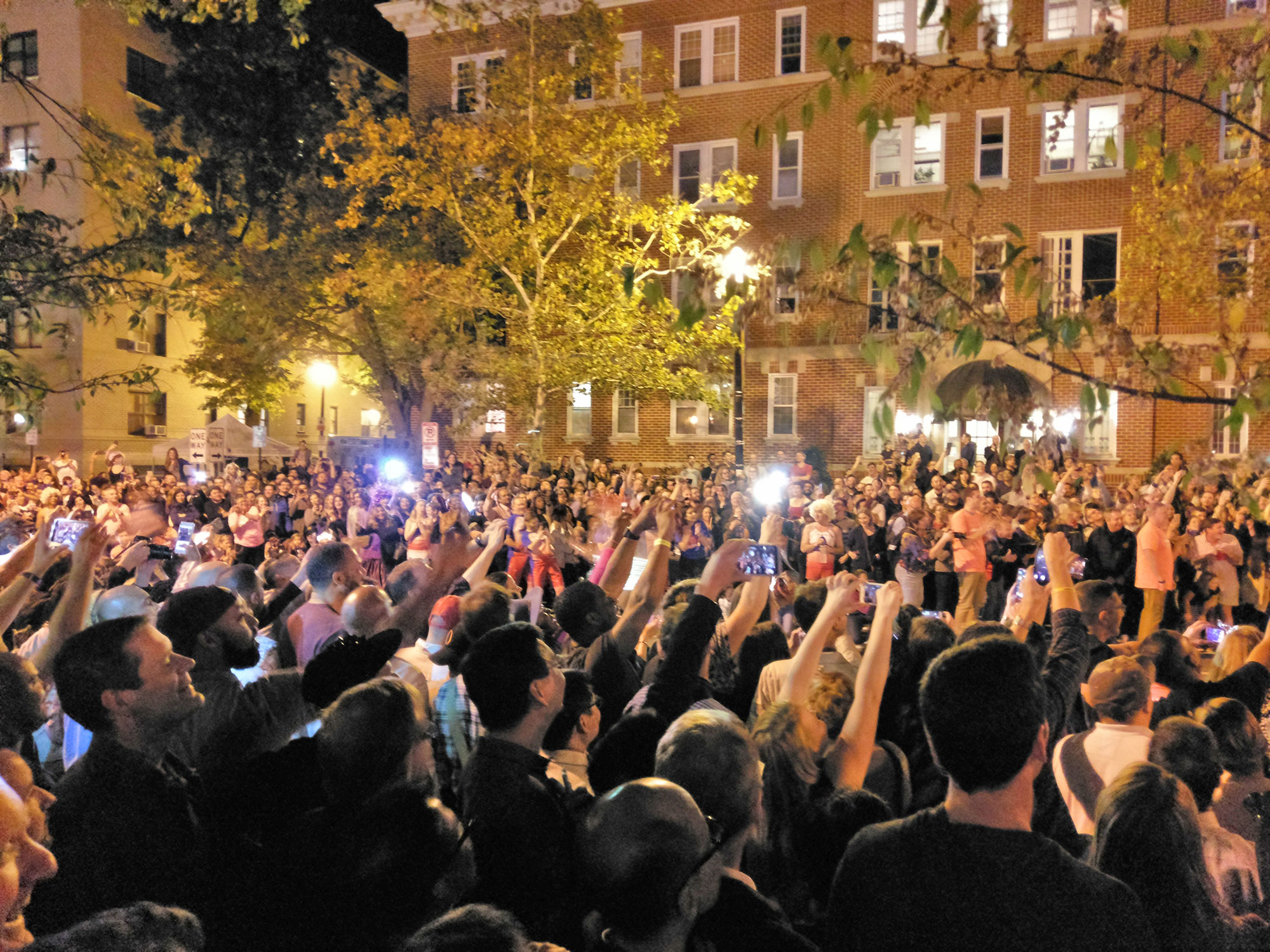 Spectators photographing the first racers at the Washington D.C. High Heel Race.